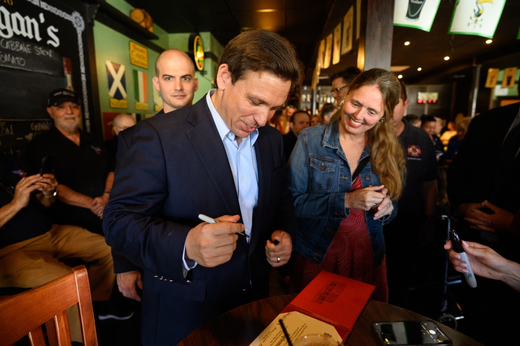 Florida Governor Ron DeSantis speaks with supporters at Flanagan's Irish Pub in Dunedin, Florida