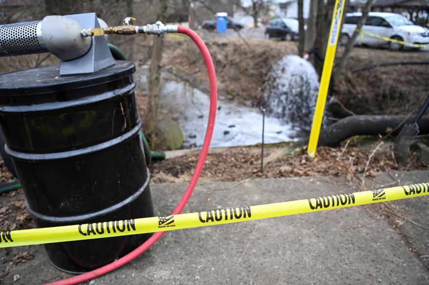 A view of a caution tape as members of the U.S. Environmental Protection Agency