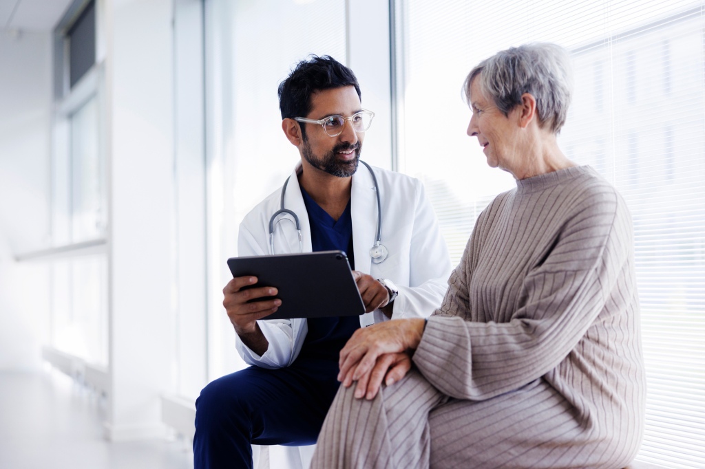 Doctor and patient discuss while seated