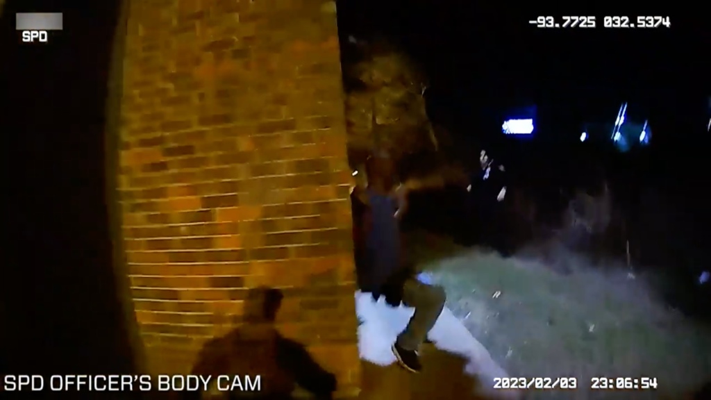 Bagley is seen slumping against a wall after being shot. 