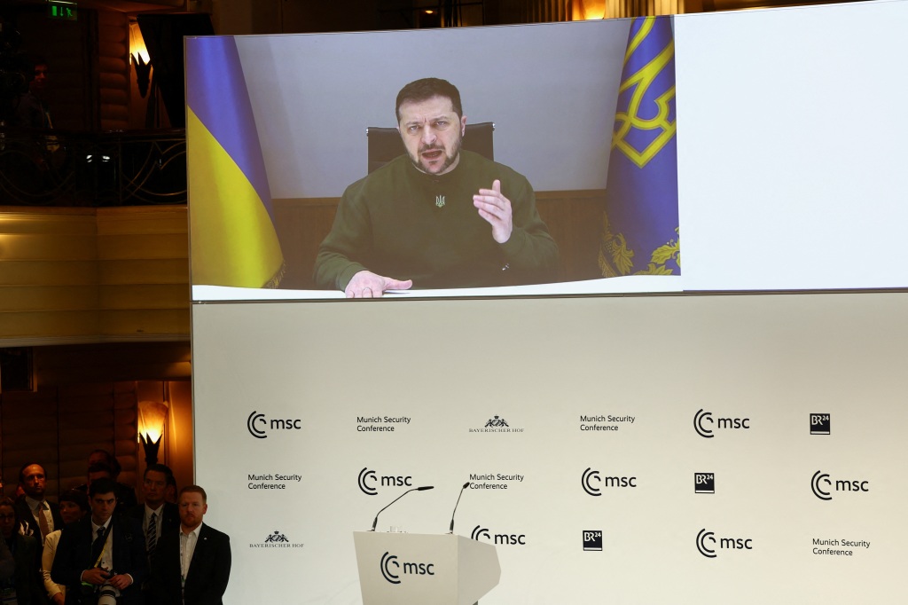 Ukrainian President Volodymyr Zelensky speaks as he appears on the screen during the Munich Security Conference, in Munich, Germany February 17.