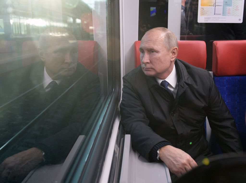 Russian President Vladimir Putin rides in a train carriage as he takes part in a ceremony inaugurating the new public transportation network in Moscow on November 21, 2019.