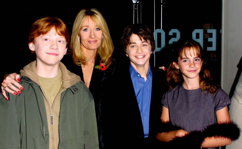Rowling with Rupert Grint, Daniel Radcliffe and Emma Watson, who starred in the films.
