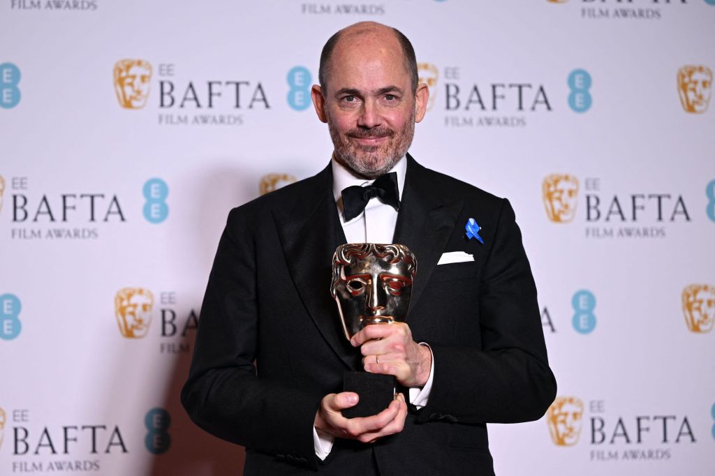 German movie director and screenwriter Edward Berger poses with the award for Best director for 'All Quiet on the Western Front' during the BAFTA British Academy Film Awards ceremony.