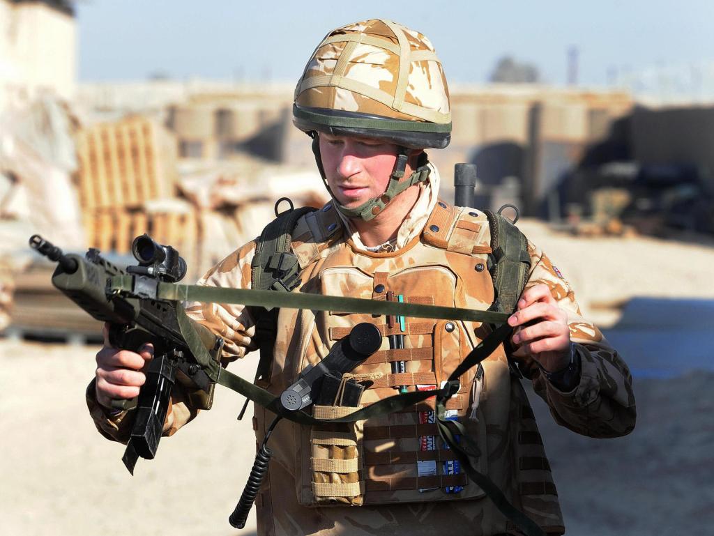 Harry holding a gun while on duty in Afghanistan in 2008.