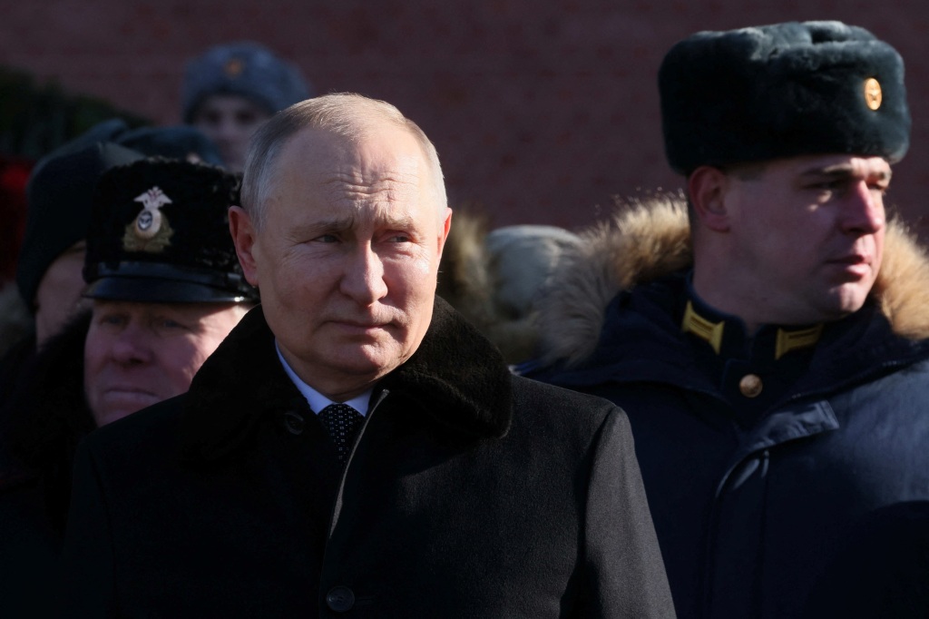 Russian President Vladimir Putin attends a wreath laying ceremony at the Tomb of the Unknown Soldier by the Kremlin Wall on the Defender of the Fatherland Day in Moscow, Russia, February 23, 2023. 