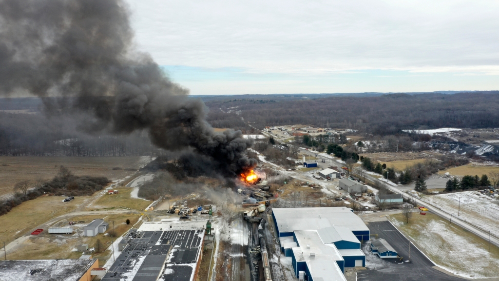 black smoke billows up from the train crash site