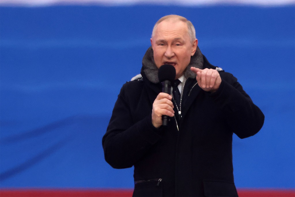 Russian President Vladimir Putin speaks during a concert in Luzhniki Stadium on February 22, 2023 