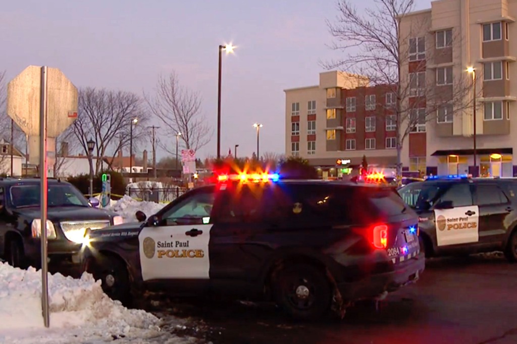 Pictured are police vehicles outside the senior living complex in St. Paul, Minn.