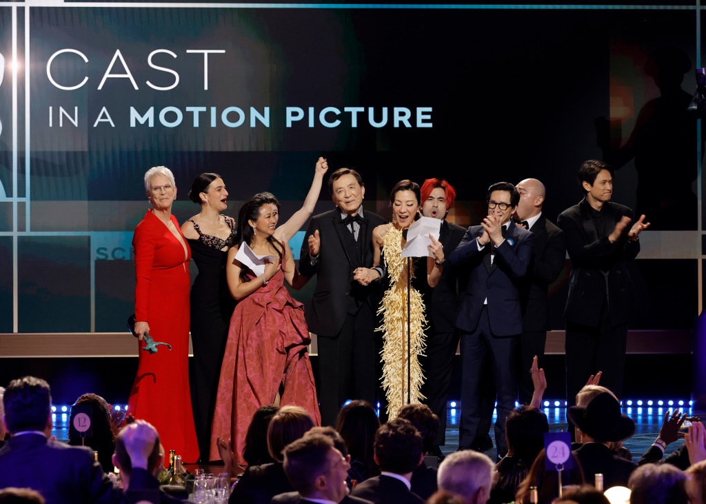 Jamie Lee Curtis, Jenny Slate, Stephanie Hsu, James Hong, Michelle Yeoh, Andy Le, Ke Huy Quan, Brian Le, and Harry Shum Jr. accept the Outstanding Performance by a Cast in a Motion Picture award for "Everything Everywhere All at Once"