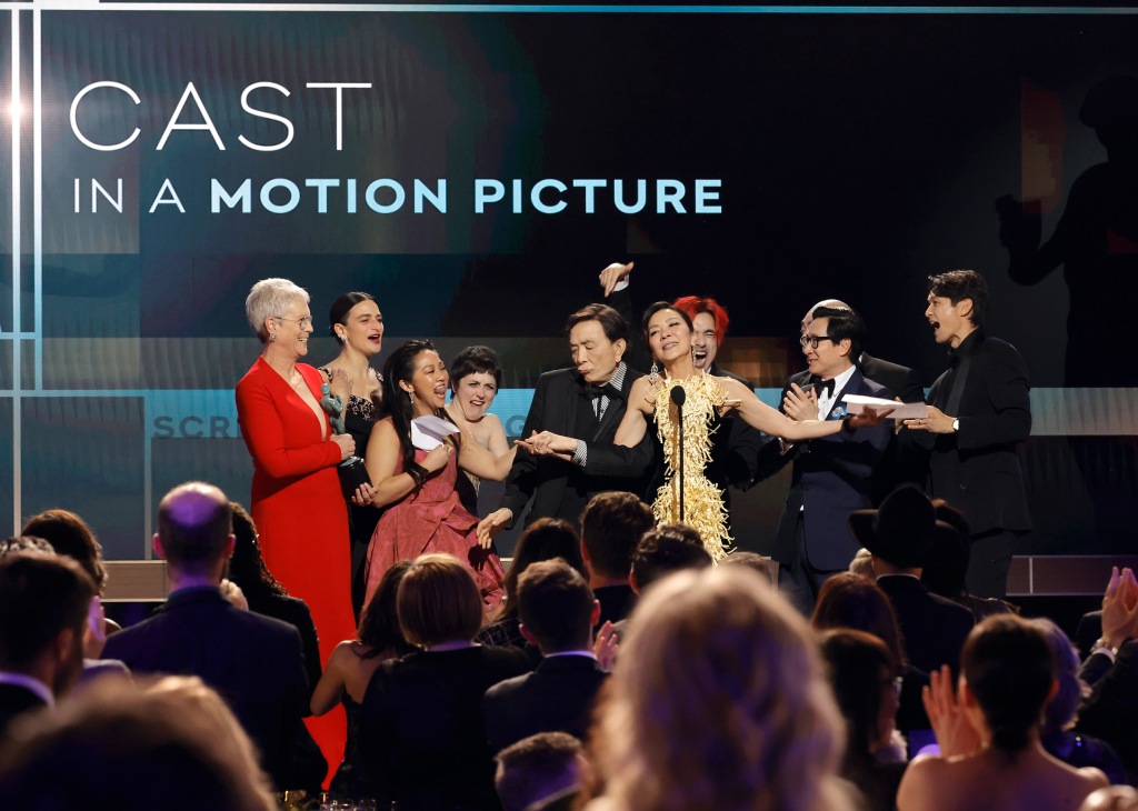 Jamie Lee Curtis, Jenny Slate, Stephanie Hsu, Tallie Medel, James Hong, Michelle Yeoh, Andy Le, Ke Huy Quan, and Harry Shum Jr. accept the Outstanding Performance by a Cast in a Motion Picture award for "Everything Everywhere All at Once" 