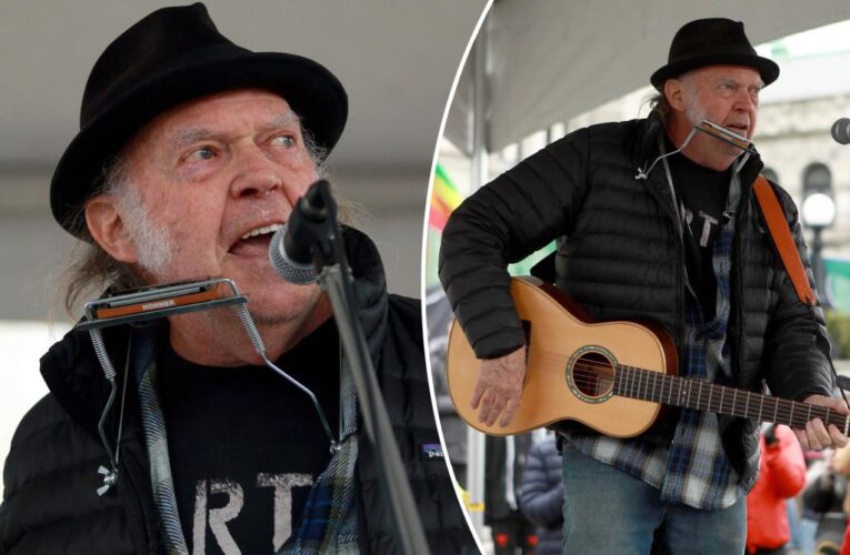 Neil Young surprises rally with first in-person performance