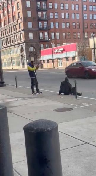 Deshawn Thomas, 23, can be seen on video struggling to load his gun as he stands near the victim in downtown St. Louis.