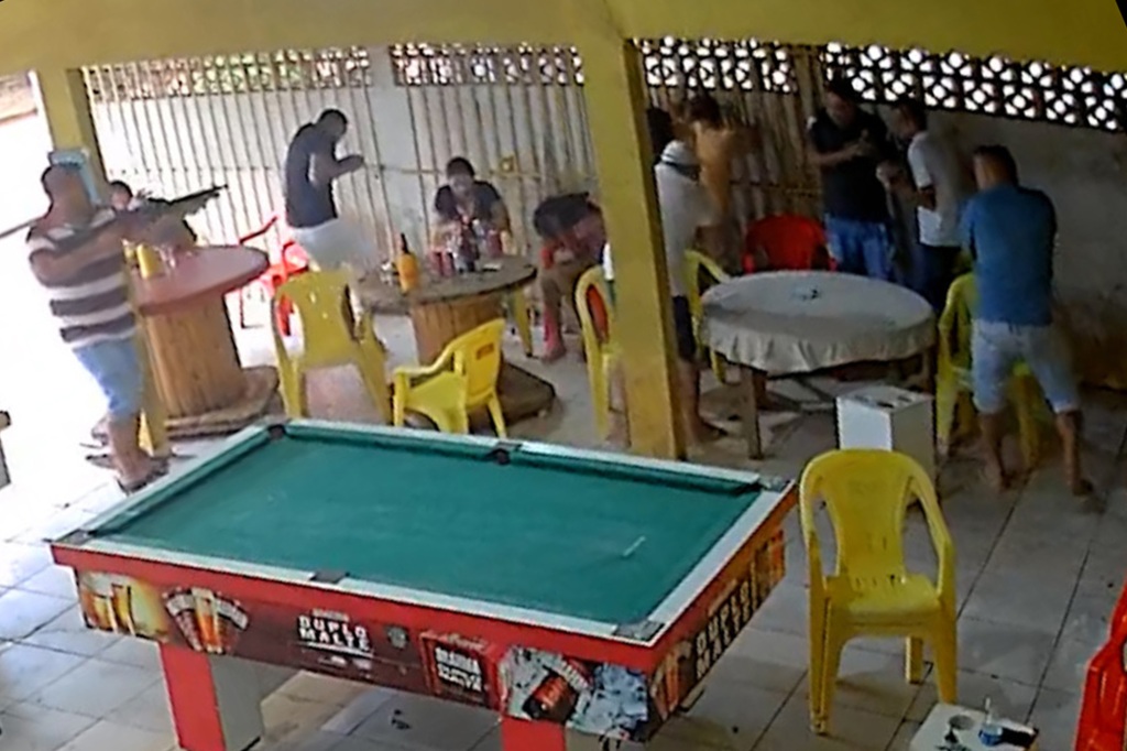 Image from video showing gunmen killing people at pool hall