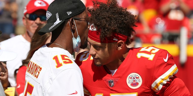 Kansas City Chiefs quarterback Patrick Mahomes hugs his father before the game against the Los Angeles Chargers on Sept. 26, 2021, at Arrowhead Stadium in Kansas City, Missouri.