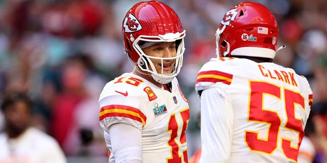 Patrick Mahomes #15 and Frank Clark #55 of the Kansas City Chiefs talk on the field prior to playing the Philadelphia Eagles in Super Bowl LVII at State Farm Stadium on February 12, 2023, in Glendale, Arizona.