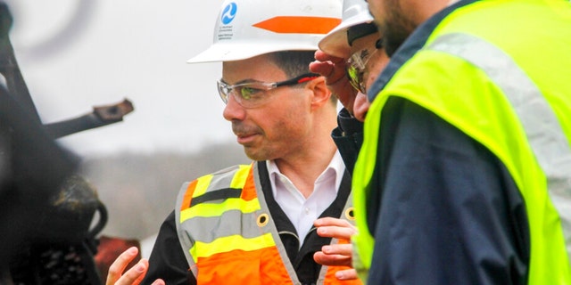 Transportation Secretary Pete Buttigieg tours the site of the Feb. 3, Norfolk Southern train derailment, Thursday, Feb. 23, 2023, in East Palestine, Ohio. 