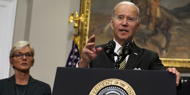 President Joe Biden delivers remarks on Oct. 19 as Energy Secretary Jennifer Granholm listens. The president has ordered the Department of Energy to release oil from the Strategic Petroleum Reserve on multiple occasions to combat high gas prices.