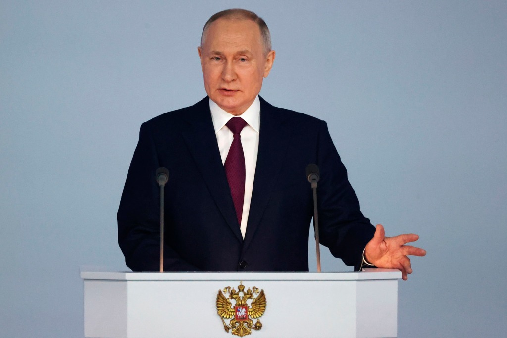 Russian President Vladimir Putin gestures as he gives his annual state of the nation address in Moscow, Russia, Tuesday, Feb. 21, 2023.