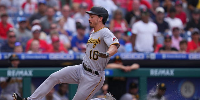 Bryan Reynolds of the Pittsburgh Pirates slides home against the Philadelphia Phillies at Citizens Bank Park Aug. 28, 2022, in Philadelphia.