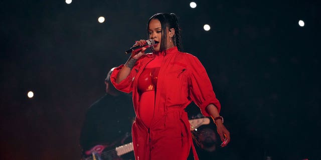 Rihanna, who was dressed in all red for her first live performance in seven years, stunned fans when it was revealed she is pregnant with her second child.