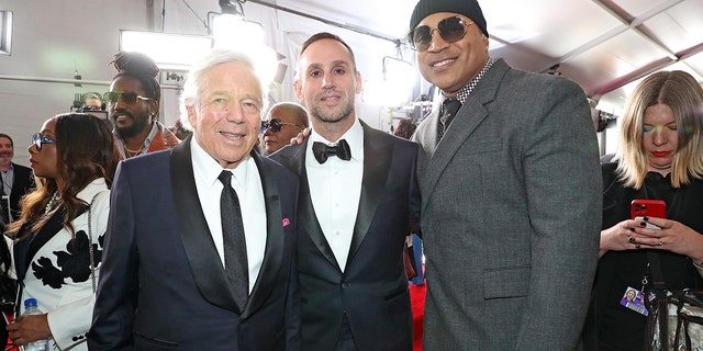 Robert Kraft, left, Michael Rubin and LL Cool J attend the 65th Grammy Awards on Feb. 5, 2023, in Los Angeles.