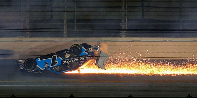 Sam Mayer flips and slides with flames during the NASCAR Xfinity Series Beef. It's What's For Dinner. 300 at Daytona International Speedway on Feb. 18, 2023. 