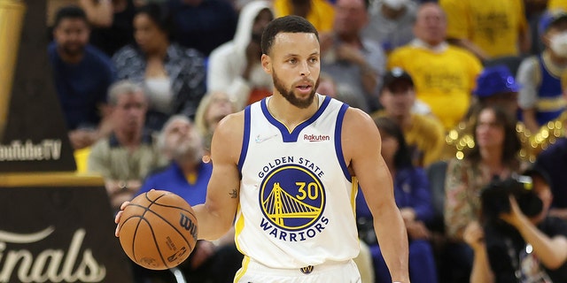 Golden State Warriors guard Stephen Curry (30) brings the ball up the court against the Boston Celtics during the first half of Game 5 of basketball's NBA Finals in San Francisco, Monday, June 13, 2022.