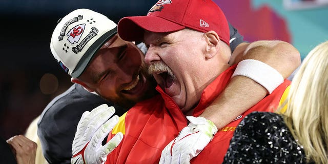 Travis Kelce #87 and head coach Andy Reid of the Kansas City Chiefs celebrate after defeating the Philadelphia Eagles 38-35 in Super Bowl LVII at State Farm Stadium on February 12, 2023 in Glendale, Arizona. 