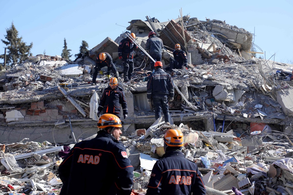 Turkish relief agency AFAD rescuers search the rubble of collapsed building in Islahiye, near Gaziantep, on Feb. 13, 2023.