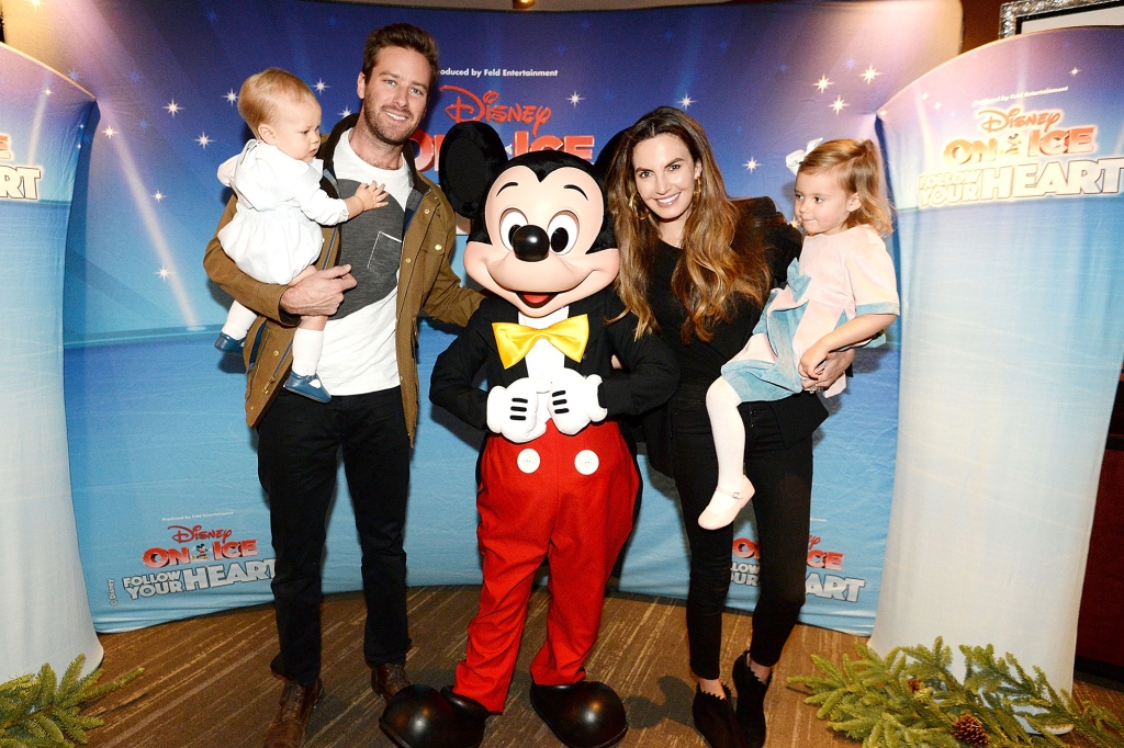 Armie Hammer poses with his then-wife, Elizabeth Chambers, their toddlers, and Mickey Mouse.