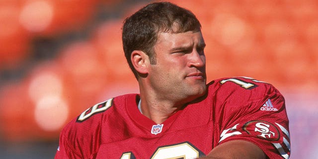 Quarterback Giovanni Carmazzi of the 49ers warms up before the Denver Broncos game at 3Com Park in San Francisco on Aug. 25, 2000.