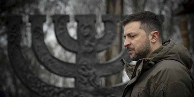 Ukrainian President Volodymyr Zelenskyy attends the ceremony at a Menorah memorial at the Babyn Yar National Historical and Memorial Reserve in honor of Holocaust Memorial Day, Jan. 27, 2023.