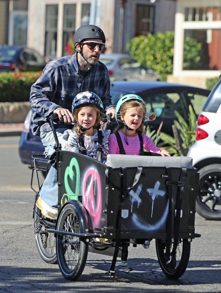  The Maroon 5 crooner rode his graffiti-sprayed bike with his two daughters and a friend near their home in Montecito, CA. 