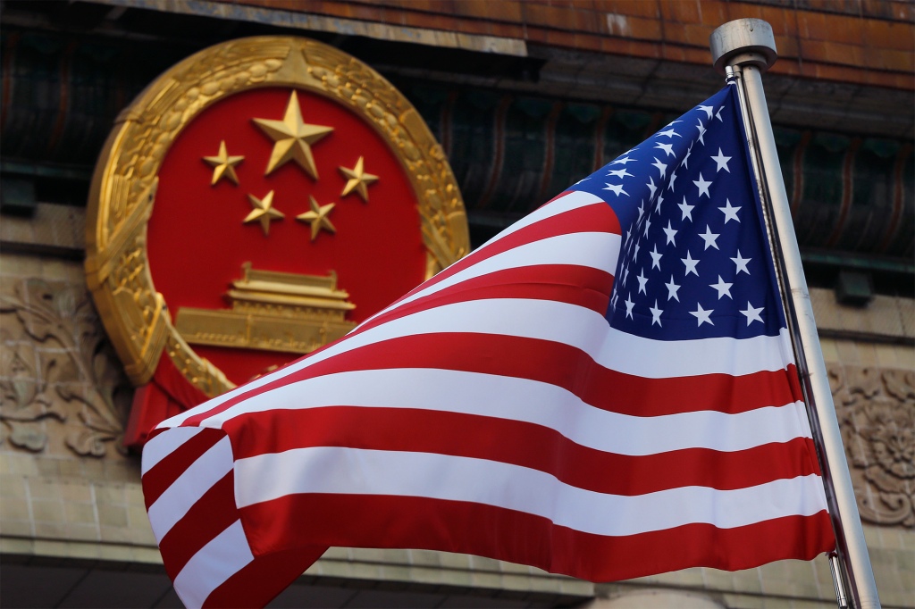 US flag in front of Chinese national emblem