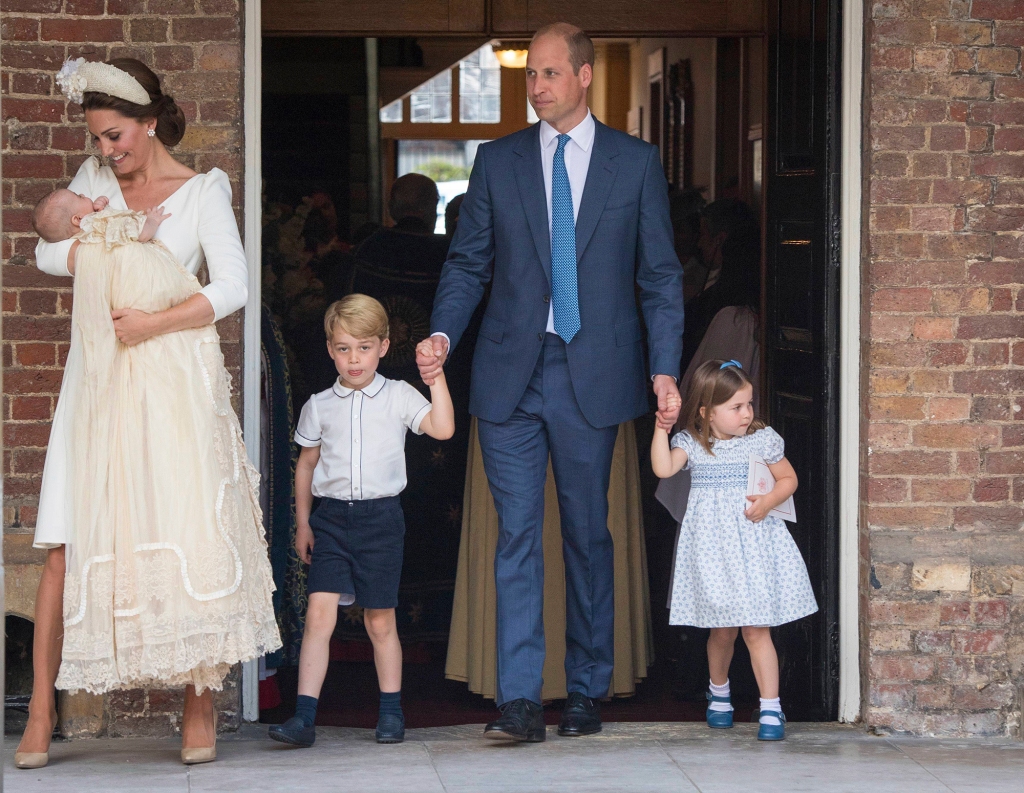 Louis is seen being cradled by Princess Kate at his christening. Prince William is seen with older children George and Charlotte. 