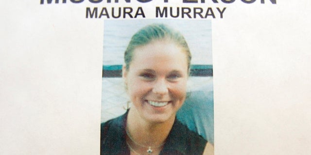 This Feb. 4, 2014 photo shows a missing person poster of Maura Murray that hangs in the lobby of the police station in Haverhill, New Hampshire.