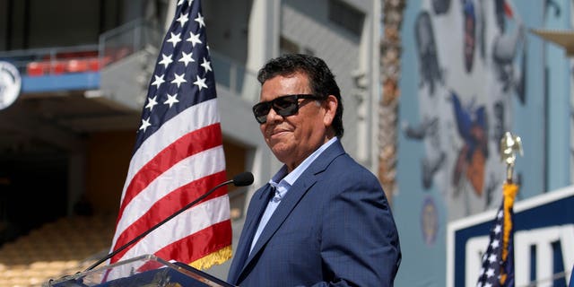 Fernando Valenzuela receives the Outstanding Americans by Choice recognition award during a special naturalization ceremony at Dodger Stadium on Aug. 29, 2022, in Los Angeles.