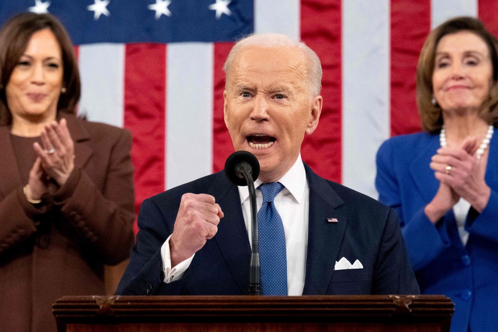 Twitter users have proposed a variety of different drinking games for tonight's State of the Union address. President Biden is pictured at last year's SOTU.