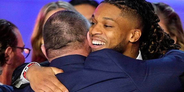 Buffalo Bills' Damar Hamlin speaks in front of University of Cincinnati Medical Center staff during the NFL Honors award show ahead of the Super Bowl 57 football game,Thursday, Feb. 9, 2023, in Phoenix.