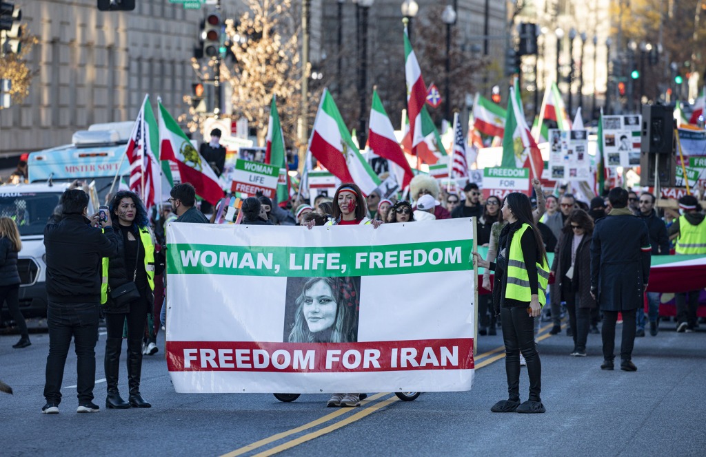 Protesters march in solidarity with protesters in Iran on the National Mall in Washington, DC