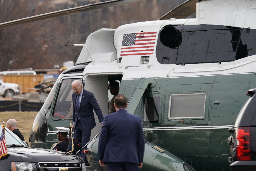 President Joe Biden descends from Marine One to attend an annual physical exam.
