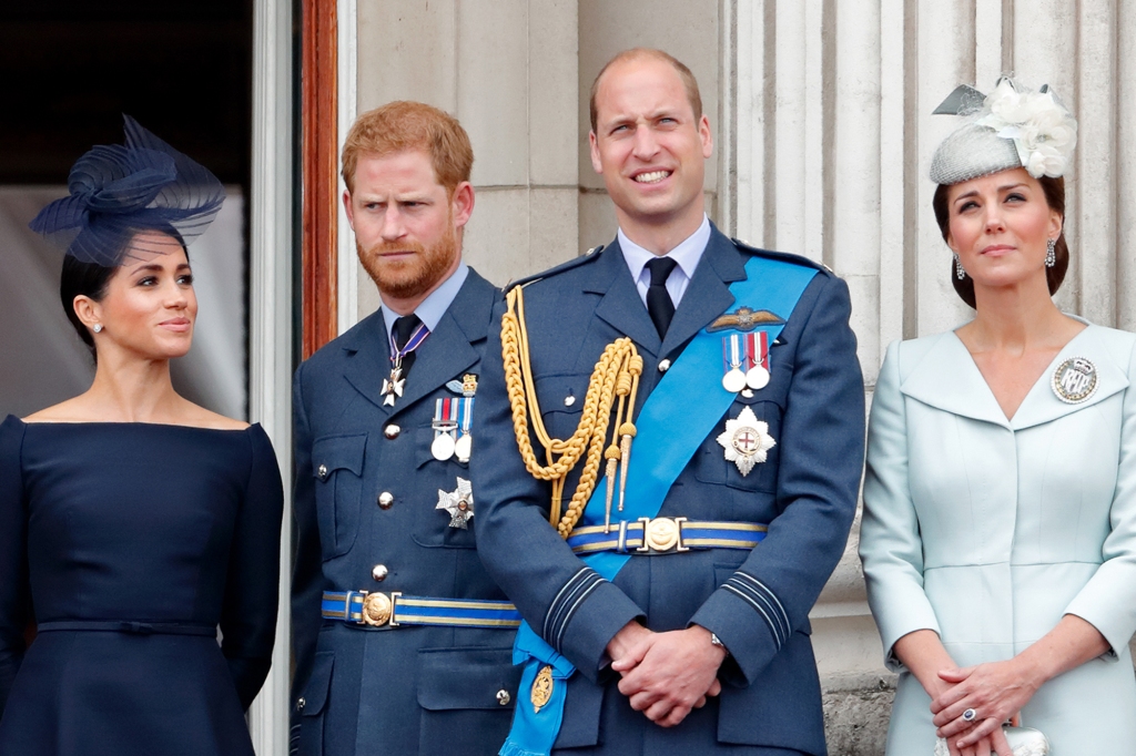 Meghan, Duchess of Sussex, Prince Harry, Duke of Sussex, Prince William, Duke of Cambridge and Catherine, Duchess of Cambridge watch a flypast to mark the centenary of the Royal Air Force from the balcony of Buckingham Palace on July 10, 2018 in London.