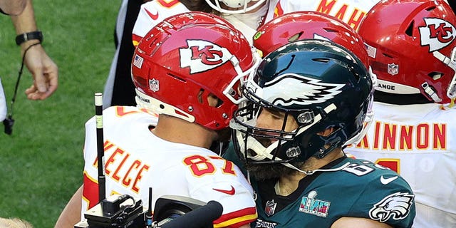 Travis Kelce #87 of the Kansas City Chiefs hugs Jason Kelce #62 of the Philadelphia Eagles before Super Bowl LVII at State Farm Stadium on February 12, 2023, in Glendale, Arizona. 