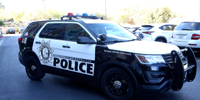 LAS VEGAS, NEVADA - OCTOBER 28: A Las Vegas Metropolitan Police Department vehicle blocks traffic during the NV COVID Trace Community Activation at Life Time Athletic on October 28, 2020, in Las Vegas, Nevada. The Activation was organized by Greg Chase of Experience Strategy Associates and Douglas Johnson of E+ Productions as a state wide PSA around COVID Trace, Nevada's contact tracing app. 