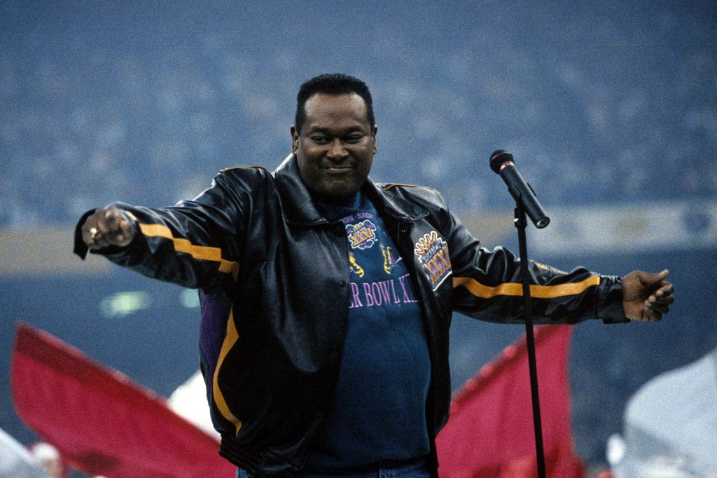 Singer Luther Vandross performs the National Anthem before Super Bowl XXXI on January 26, 1997, at the Louisiana Superdome in New Orleans, Louisiana. 