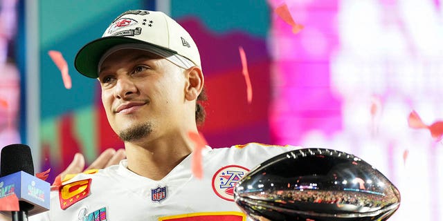 Patrick Mahomes #15 of the Kansas City Chiefs hoists the Lombardi Trophy after Super Bowl LVII against the Philadelphia Eagles at State Farm Stadium on February 12, 2023 in Glendale, Arizona. The Chiefs defeated the Eagles 38-35. 