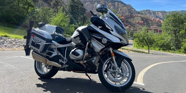 An Arizona Department of Public Safety motorcycle sits on a roadway.