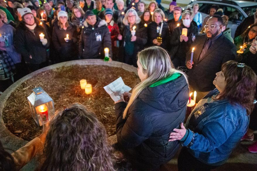 A teacher speaks to attendees during a vigil at the Newport News Public Schools Administration building on Jan. 9.