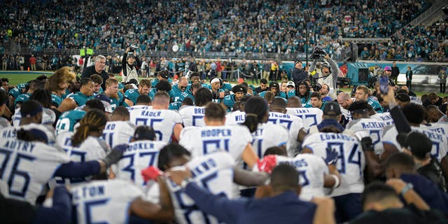 Tennessee Titans and Jacksonville Jaguars NFL teams prayed on the field for Buffalo Bills safety Damar Hamlin before the game, Jan. 7, 2023, in Jacksonville, Fla.